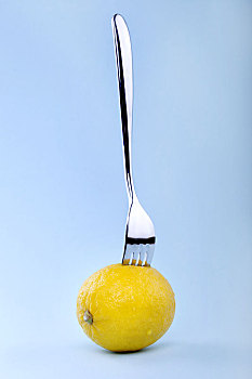 inserted,fork,grapefruit