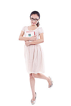 young,woman,standing,hugging,a,book