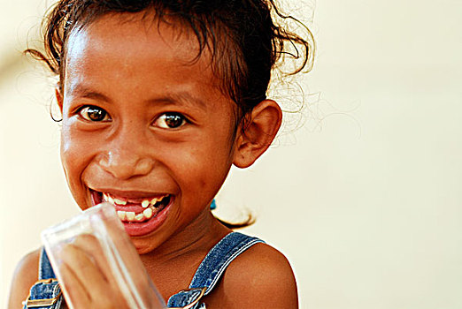 portrait,of,blond,timorese,girl,with,dark,eyes