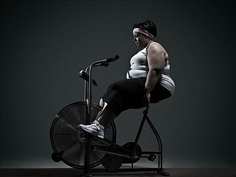 超重,女人,健身自行车
