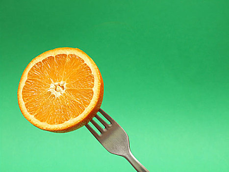 橙色,叉子,绿色背景