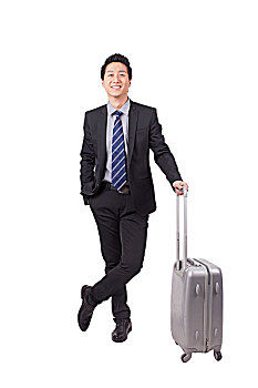 一个拿行李箱的青年商务男士