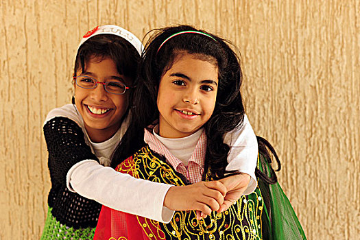 kuwait,city,portrait,of,two,kuwaiti,girls,smiling,and,hugging