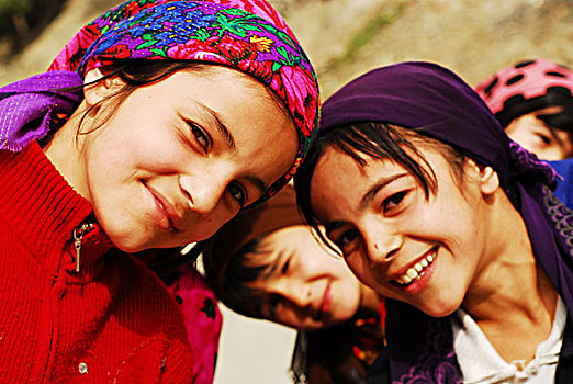 tajikistan,penjakent,group,of,girls,in,traditional,dress,smiling