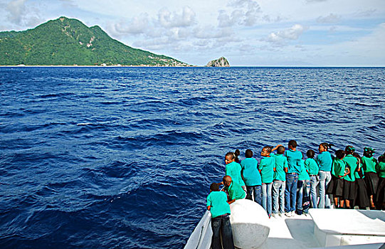 dominica,roseau,schoolchildren,looking,for,dolphins,and,whales,on,the,boat,during,unicef,-,environmental,network,whalewatching,progra