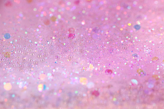 闪烁的粉色珍珠细沙背景