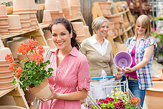 花卉商店,女人,拿着,红色,盆栽,天竺葵