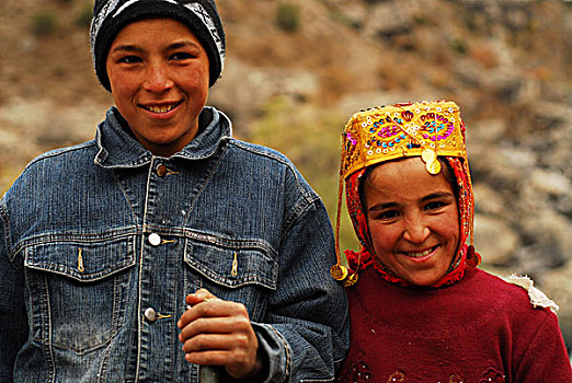 tajikistan,fann,mountains,portrait,of,little,girl,in,traditional,dress,with,her,smiling,brother