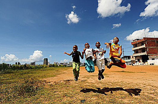 brazil,bahia,salvador,children,jumping,during,art,in,all,of,us,activity,favela