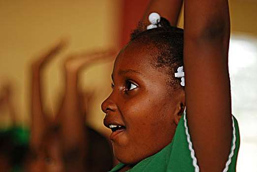 dominica,roseau,preschool,social,center,young,girl,raising,hand,excited