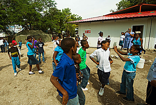 haiti,port,au,prince,petionville,club,camp,children,learning,to,take,photographs