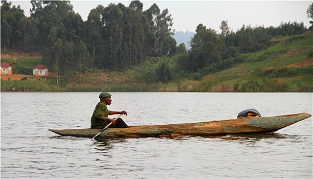 非洲男人,短桨,独木舟