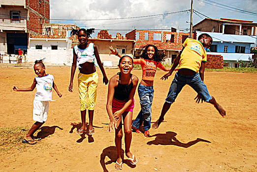 brazil,bahia,salvador,children,jumping,during,art,in,all,of,us,activity,favela