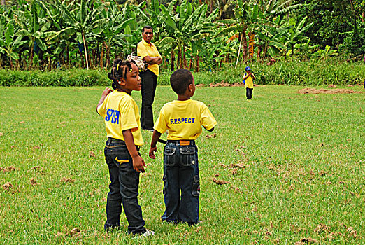 dominica,carib,territory,children,at,a,school,fair,with,respect,yellow,t-shirt