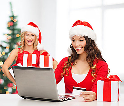 圣诞节,圣诞,网上购物,概念,女人,圣诞老人,帽子,礼盒,笔记本电脑,信用卡