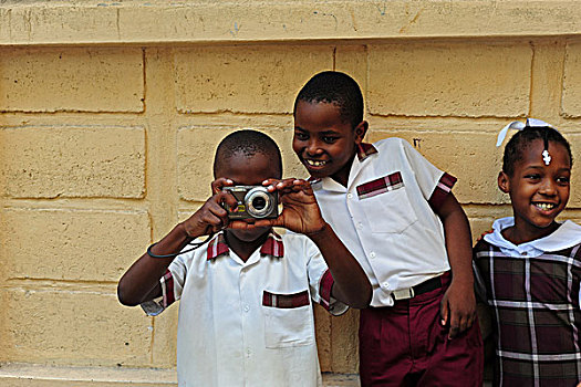 haiti,port,au,prince,schoolboy,taking,a,photograph
