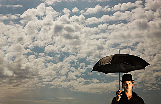 一个,男人,戴着,大礼帽,拿着,伞,天空,云