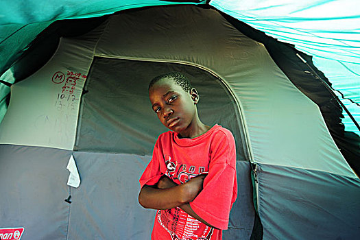 haiti,port,au,prince,portrait,of,children,in,front,tent,refugee,camp
