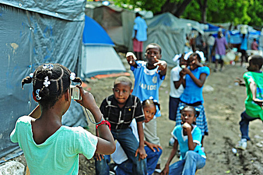 haiti,port,au,prince,petionville,club,camp,children,learning,to,take,photographs
