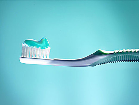 牙刷,青绿色,牙膏,正面,蓝色背景