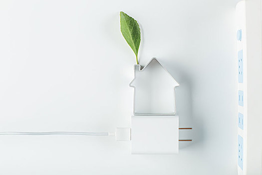 小房子和插头,节约用电环保创意图片