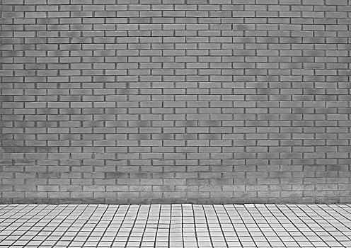 灰砖装饰墙和白瓷砖地面agreybrickwallandtilefloor