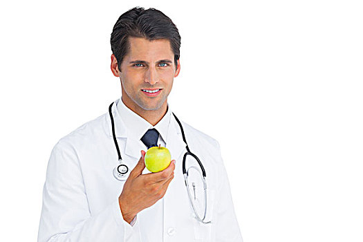 医生,拿着,苹果,看镜头,微笑,白色背景