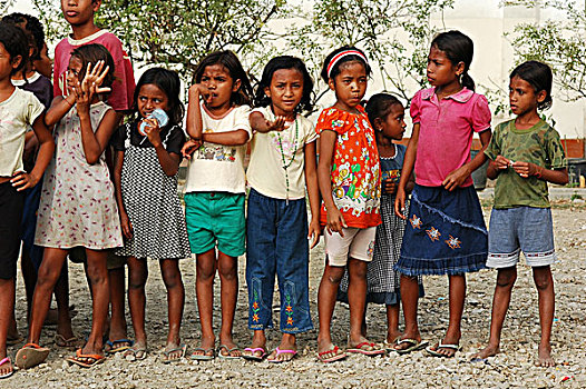 4,four,timorese,men,smiling,at,the,camera,with,different,skin,color,-,3,blurred