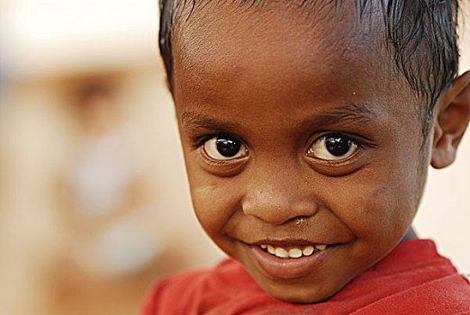 child,with,compact,camera,in,his,hand