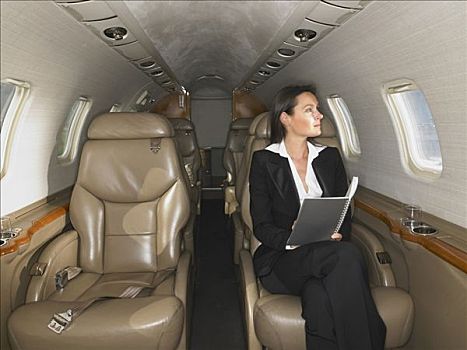 职业女性,坐,私人飞机,工作
