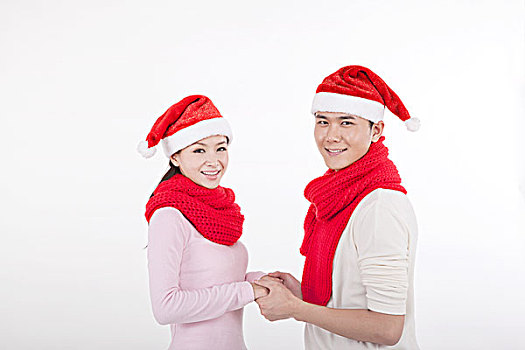 戴着圣诞帽的青年伴侣