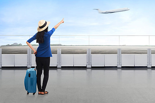 旅行者,亚洲女性,手提箱,看,飞机