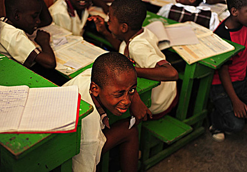 haiti,port,au,prince,portrait,of,boy,in,classroom