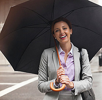 职业女性,拿着,伞,城市街道