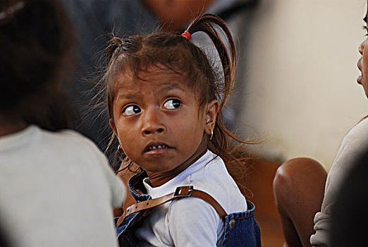 portrait,of,young,timorese,girl,with,dark,deep,brown,eyes