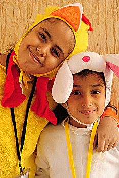 kuwait,city,portrait,of,2,smiling,girls,disguised,as,rabbit