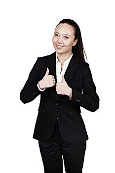 年轻的商务女士竖起大拇指