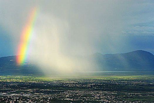 haiti,port,au,prince,view,of,a,rainbow,storm,from,montagne,noire