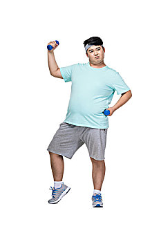 肥胖的青年男子在做运动