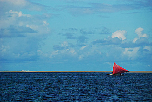 brazil,pernambuco,ilha,de,itamaraca,red,sailing,boat,in,the,ocean