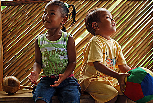 dominica,carib,territory,brother,and,sister,playing,with,a,soft,ball