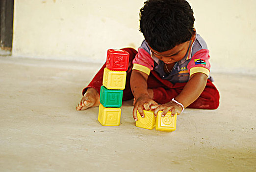 dominica,carib,territory,little,boy,playing,with,ludic,construction,toys