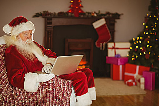 圣诞老人,使用笔记本,沙发,圣诞节