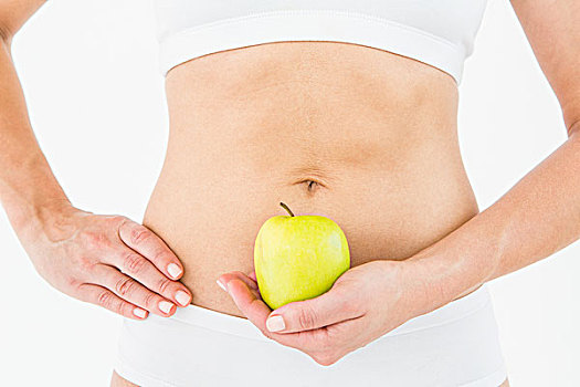 健身,女人,拿着,苹果,正面,腹部
