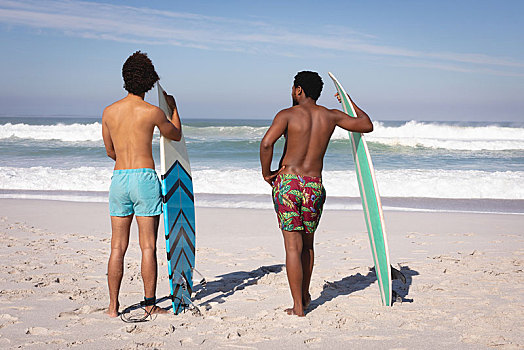 男青年,冲浪板,站立,海滩,阳光