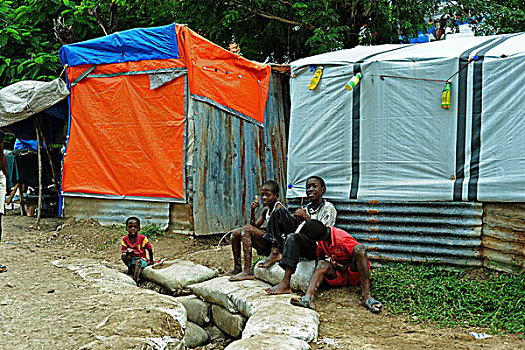 haiti,port,au,prince,petionville,club,camp,prepating,water,stream,with,sandbags,forflooding,prevention