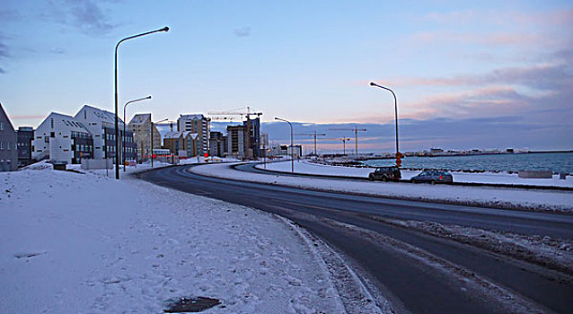 iceland,reykjavik,citiscape,with,offices,and,atlantic,ocean,in,snow,background