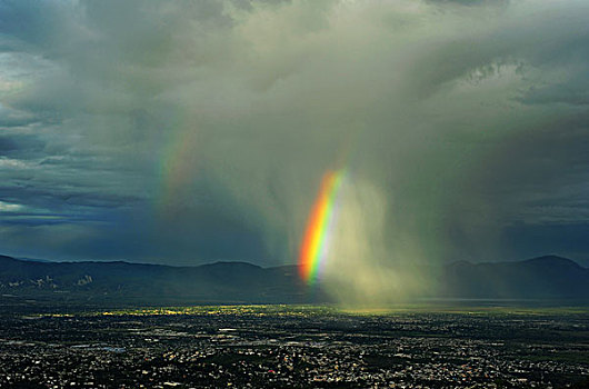 haiti,port,au,prince,view,of,a,rainbow,storm,from,montagne,noire