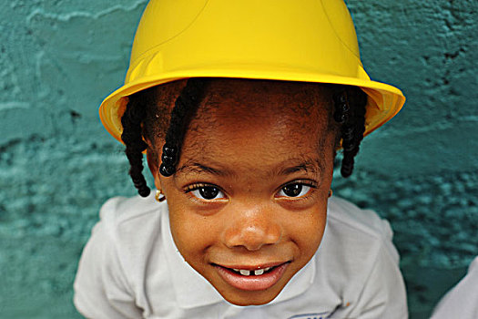 dominica,roseau,preschool,ccf,portrait,of,young,girl,with,a,construction,worker,hat