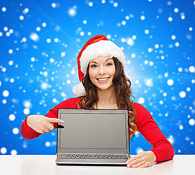 圣诞节,休假,科技,广告,人,概念,微笑,女人,圣诞老人,帽子,手指,留白,笔记本电脑,显示屏,上方,蓝色,雪,背景
